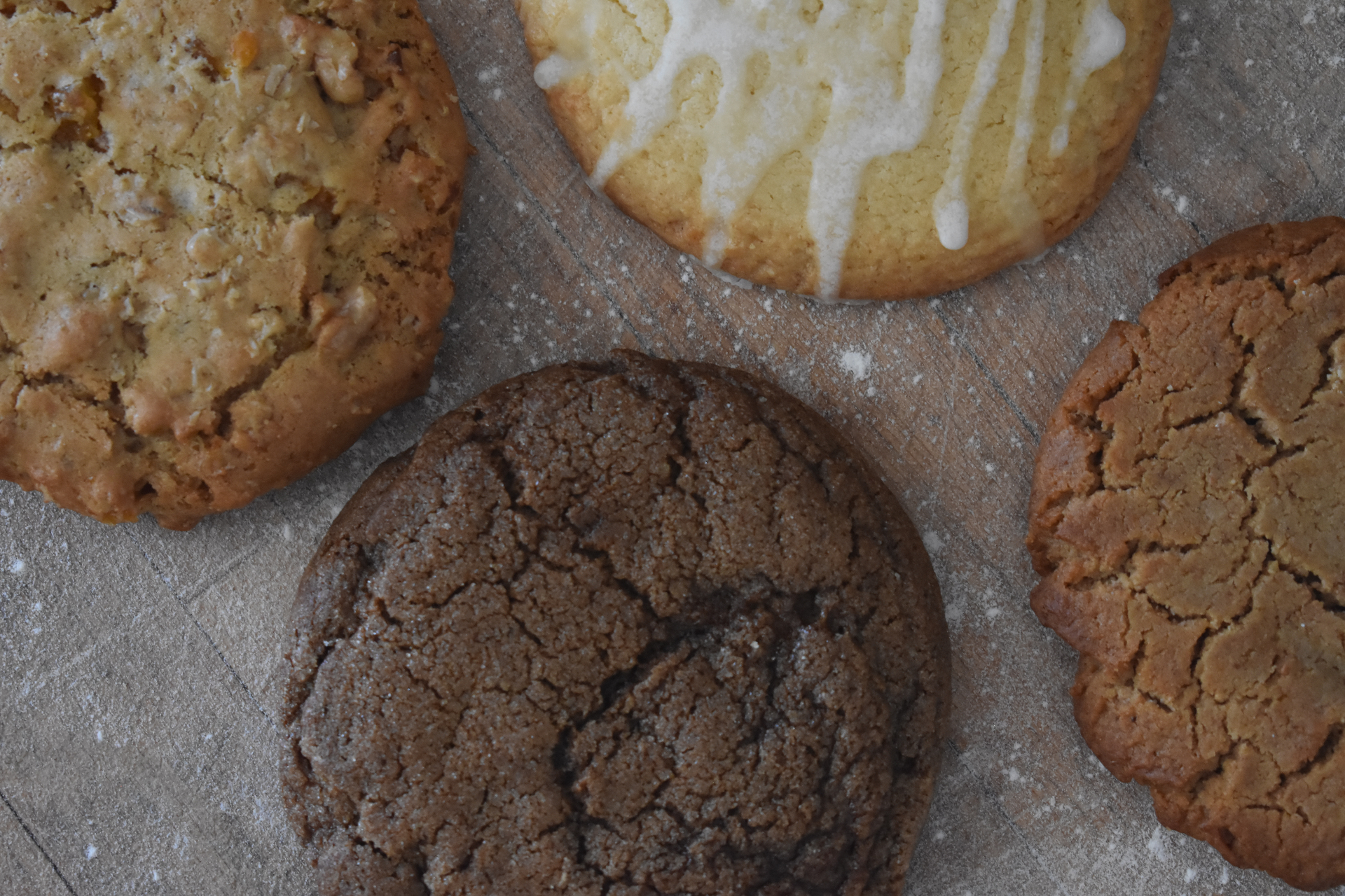 Assorted artisanal cookies including chocolate chip, glazed, and specialty varieties